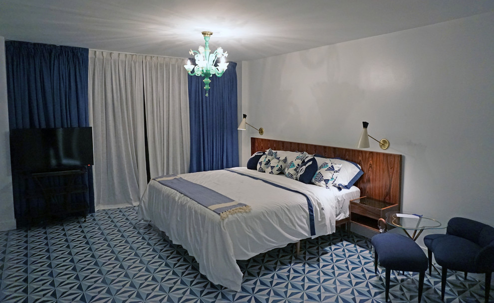 Photo of a midcentury bedroom in Miami with ceramic floors.