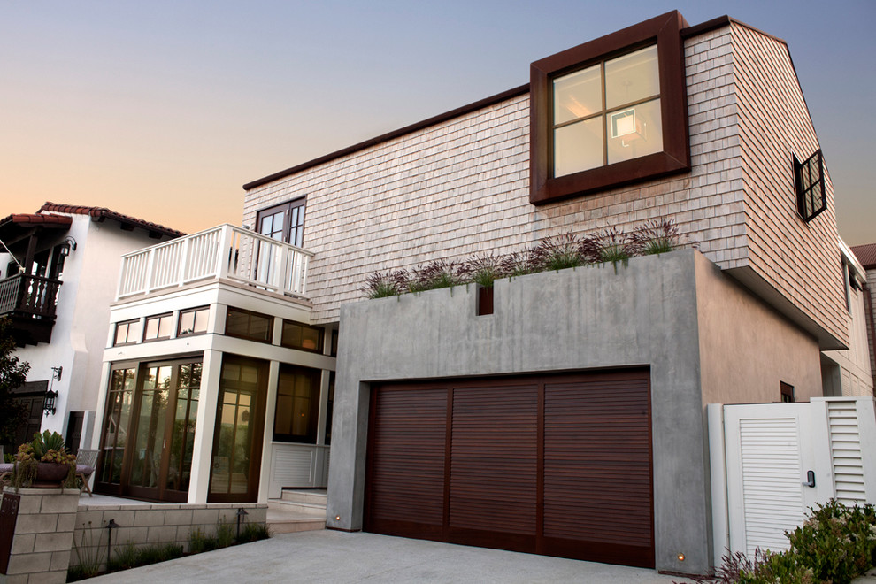 Mid-sized transitional two-storey exterior in Los Angeles with wood siding.