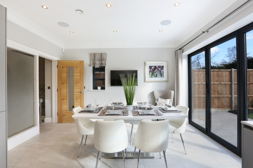 Inspiration for a mid-sized contemporary separate dining room in Hertfordshire with white walls and white floor.