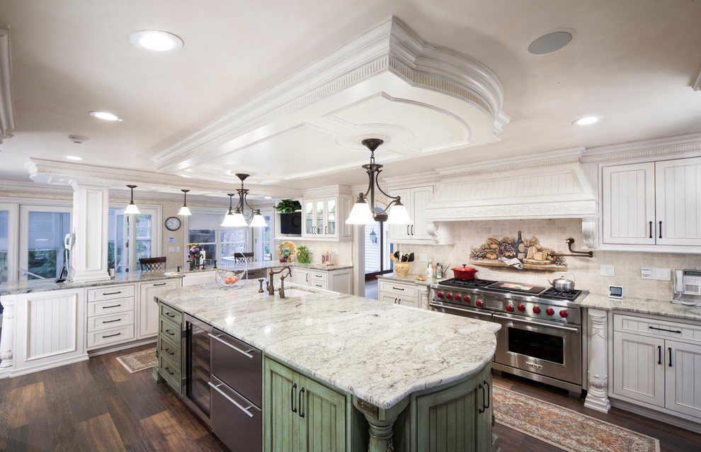 Inspiration for a traditional kitchen in New York with an undermount sink, louvered cabinets, white cabinets, beige splashback, stainless steel appliances, medium hardwood floors and with island.