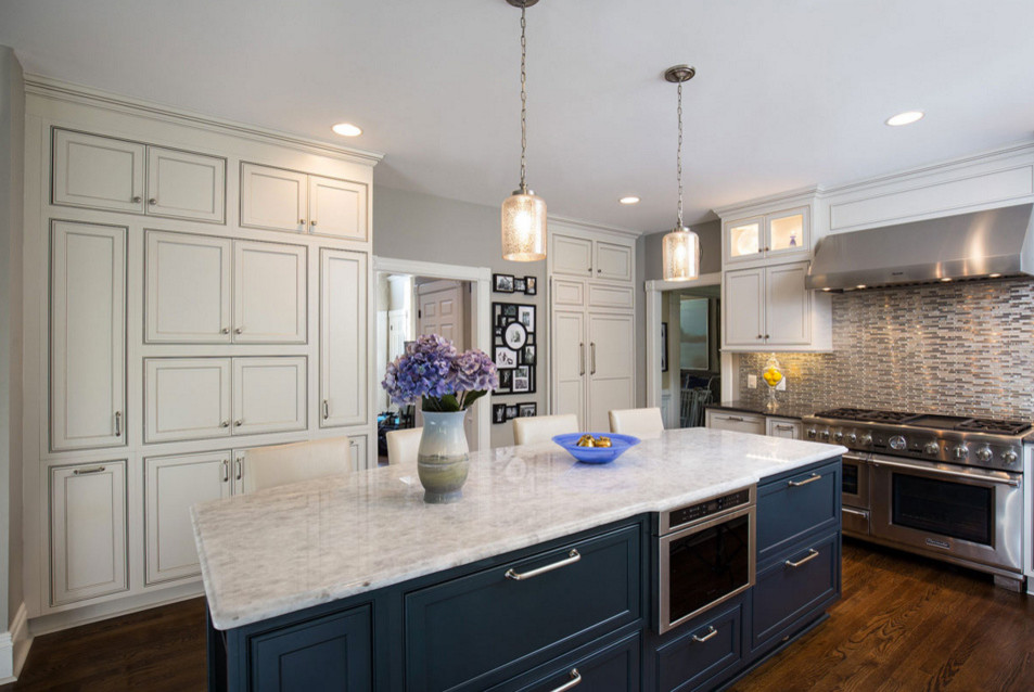 Inspiration for a large transitional u-shaped separate kitchen in DC Metro with white cabinets, marble benchtops, stainless steel appliances, dark hardwood floors, with island, beaded inset cabinets, metallic splashback and matchstick tile splashback.