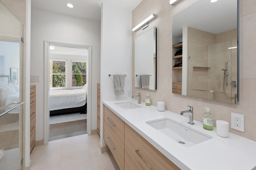 Large traditional ensuite bathroom in San Francisco with flat-panel cabinets, light wood cabinets, an alcove bath, a built-in shower, beige tiles, ceramic tiles, beige walls, ceramic flooring, a submerged sink, engineered stone worktops, beige floors, a hinged door, white worktops, a shower bench, double sinks, a built in vanity unit and a wallpapered ceiling.