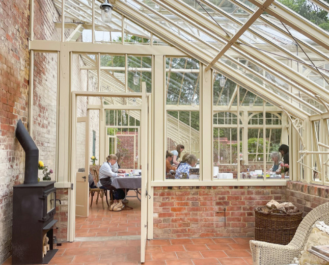 Design ideas for an expansive traditional attached greenhouse in Surrey.