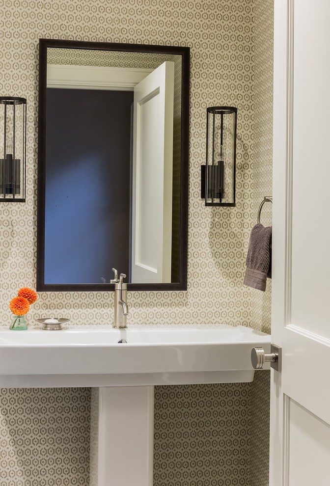 This is an example of a small transitional powder room in Boston with a pedestal sink and multi-coloured walls.