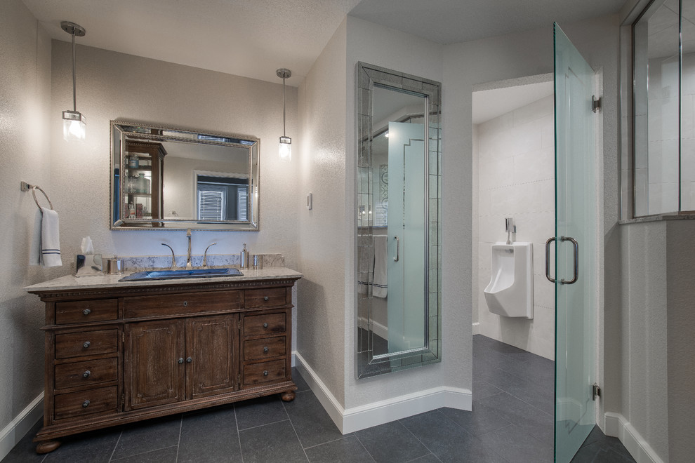 This is an example of a large country master bathroom in Denver with furniture-like cabinets, distressed cabinets, a double shower, a two-piece toilet, white tile, porcelain tile, beige walls, ceramic floors, a drop-in sink, engineered quartz benchtops, grey floor, a hinged shower door and multi-coloured benchtops.