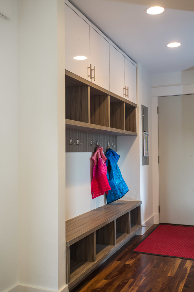 Inspiration for a small transitional dark wood floor hallway remodel with white walls