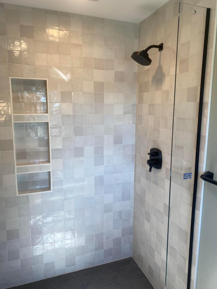 Mid-sized minimalist master white tile and porcelain tile porcelain tile, black floor and single-sink bathroom photo in Grand Rapids with shaker cabinets, medium tone wood cabinets, a two-piece toilet, an undermount sink, quartz countertops, white countertops, a niche and a built-in vanity