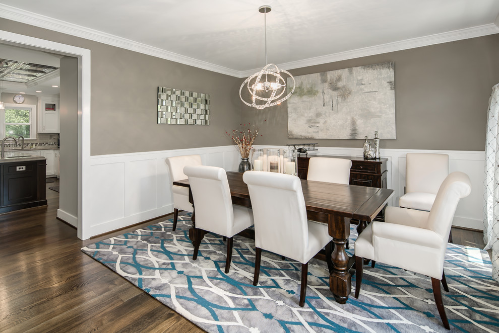 Mid-sized transitional separate dining room in DC Metro with multi-coloured walls, dark hardwood floors and brown floor.