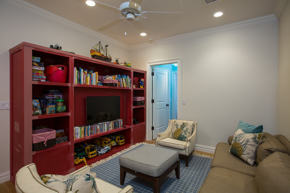Inspiration for a mid-sized beach style gender-neutral kids' playroom for kids 4-10 years old in Miami with white walls and medium hardwood floors.