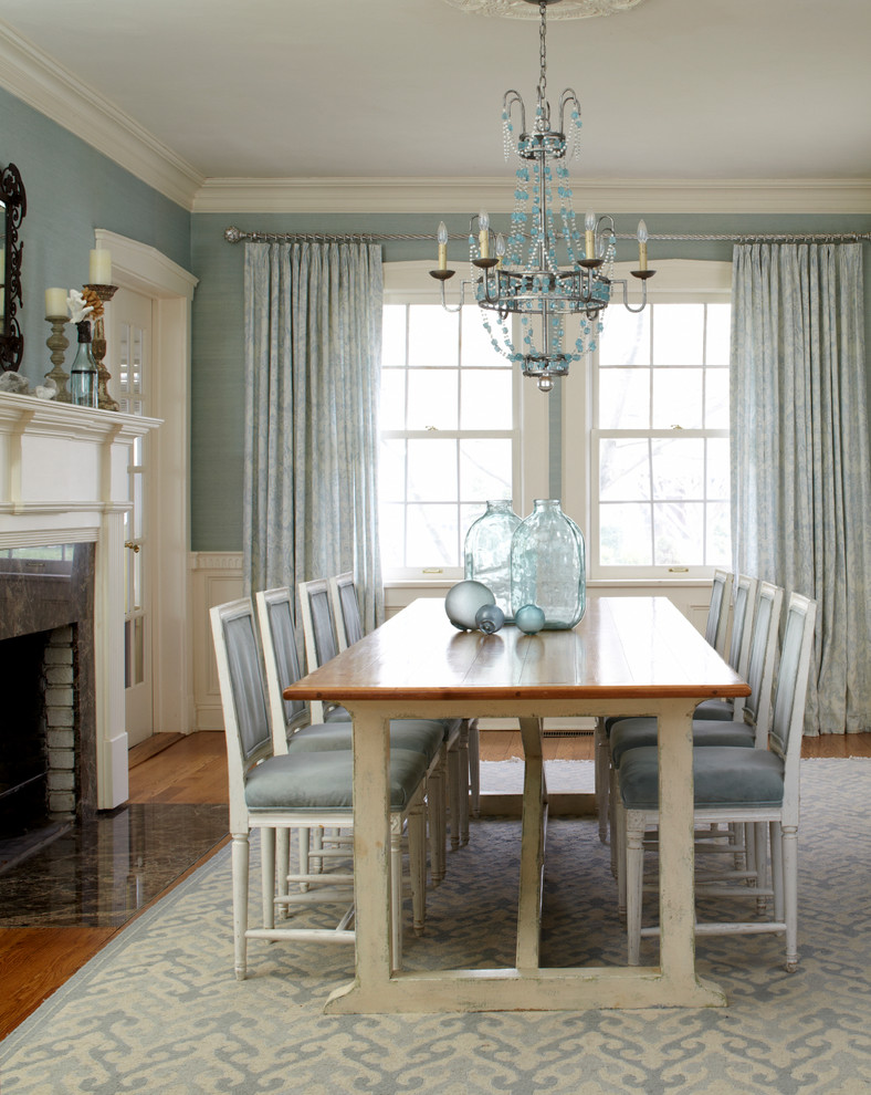 Inspiration for a beach style dining room in New York with blue walls.