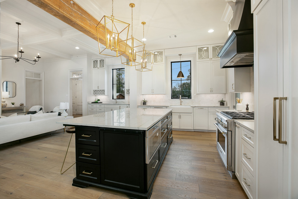 Mid-sized transitional eat-in kitchen in New Orleans with a farmhouse sink, raised-panel cabinets, white cabinets, quartzite benchtops, grey splashback, marble splashback, panelled appliances, light hardwood floors, with island, brown floor, multi-coloured benchtop and coffered.