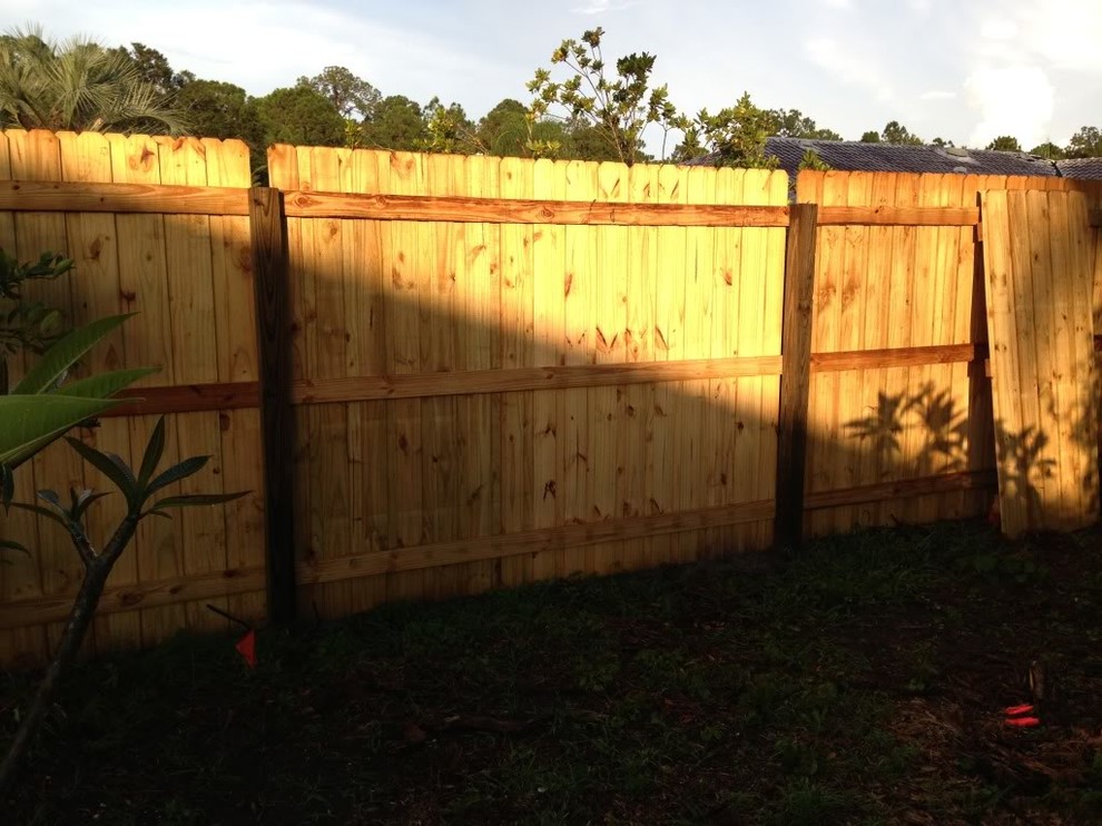 Would I stain or paint a wood fence like a deck?