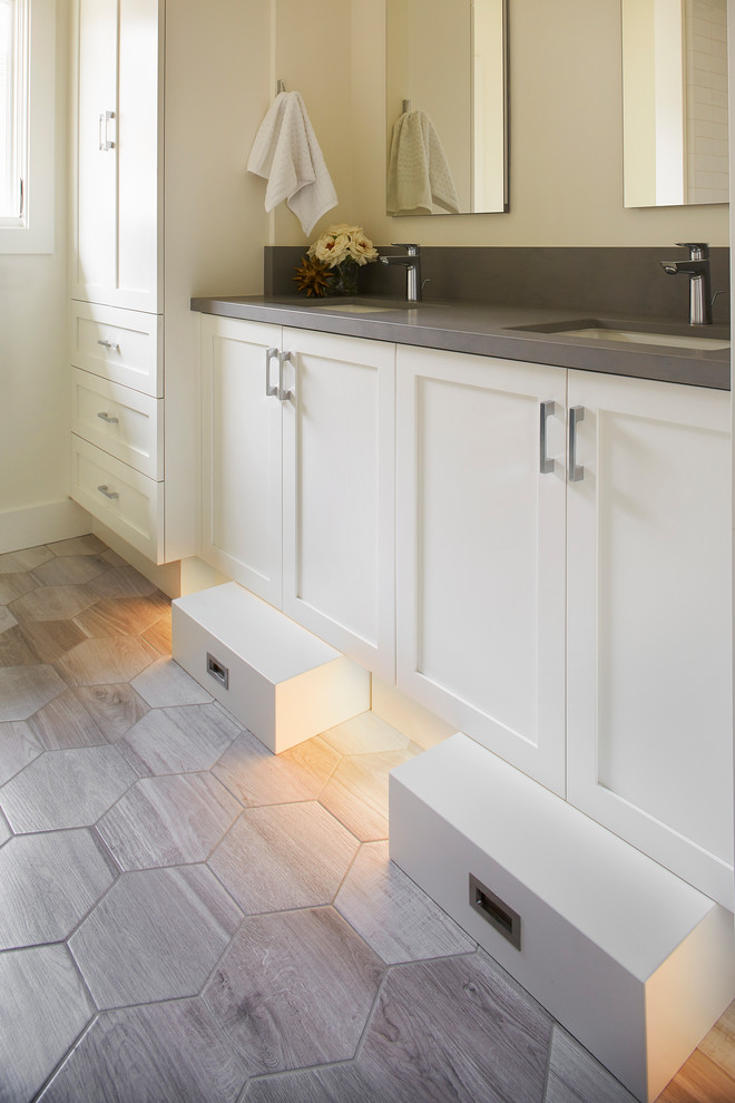 Design ideas for a transitional bathroom in San Francisco with shaker cabinets, white cabinets, porcelain floors, an undermount sink, quartzite benchtops, grey floor and grey benchtops.