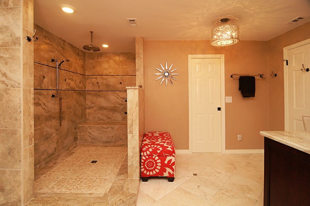 This is an example of a large traditional master bathroom in Tampa with an undermount sink, recessed-panel cabinets, dark wood cabinets, granite benchtops, a corner shower, a two-piece toilet, beige tile, stone tile, orange walls and travertine floors.