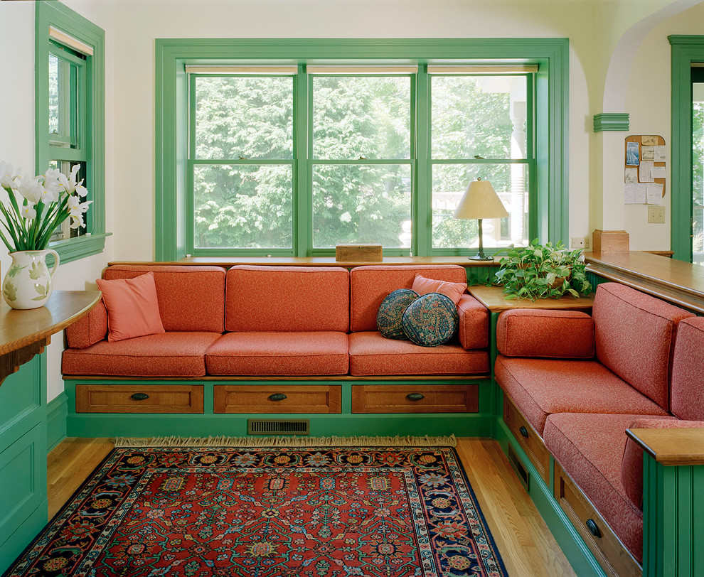 Photo of a traditional family room in Boston with beige walls and medium hardwood floors.