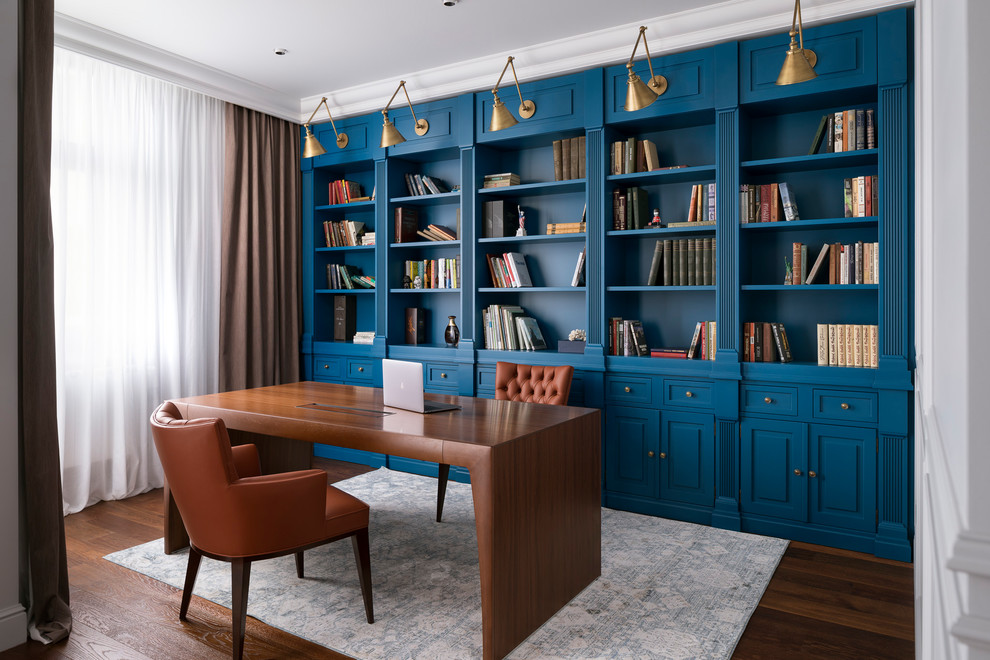 This is an example of a contemporary home office in Other with a library, dark hardwood floors, no fireplace, a freestanding desk and brown floor.