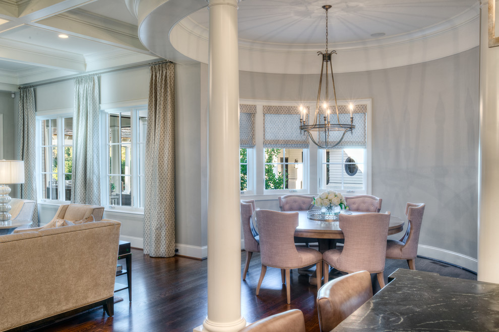 Example of a mid-sized transitional dark wood floor kitchen/dining room combo design with gray walls and no fireplace