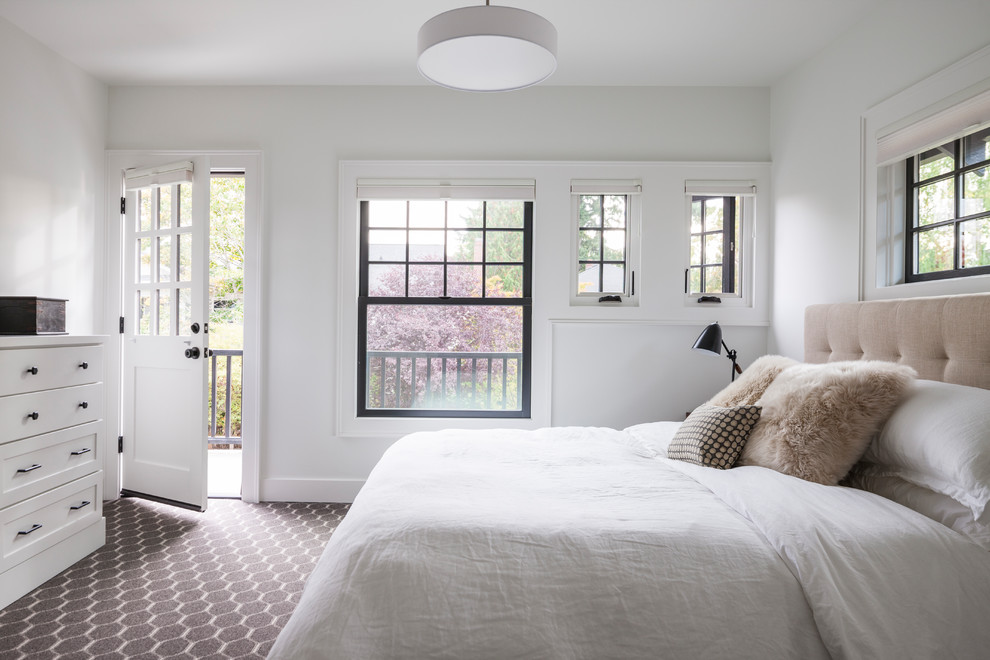 Photo of a large transitional master bedroom in Seattle with white walls, carpet, no fireplace and multi-coloured floor.