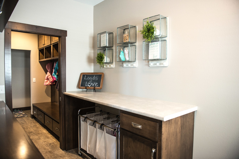 Mid-sized transitional galley dedicated laundry room in Chicago with flat-panel cabinets, medium wood cabinets, granite benchtops, grey walls, vinyl floors and a side-by-side washer and dryer.