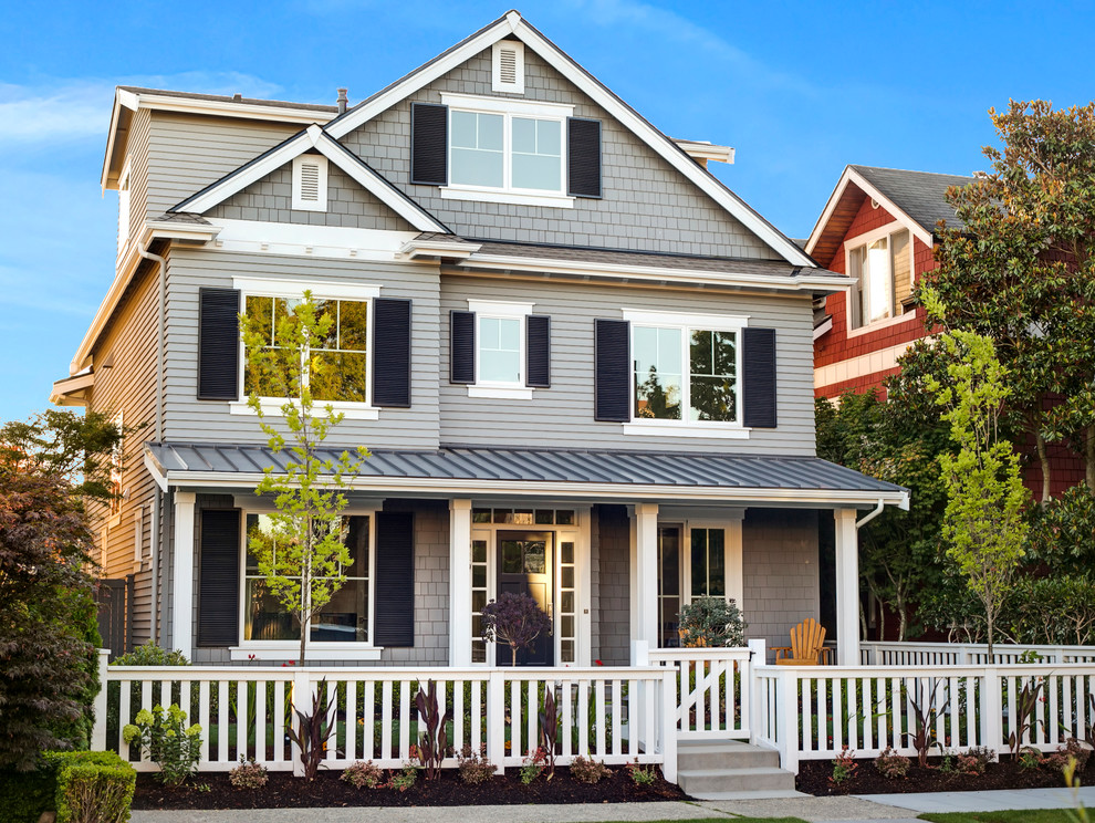 Inspiration for a large craftsman gray three-story wood gable roof remodel in Seattle