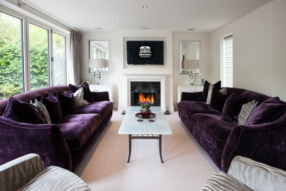 Inspiration for a medium sized traditional formal enclosed living room with white walls, carpet, a standard fireplace, a wooden fireplace surround and a wall mounted tv.