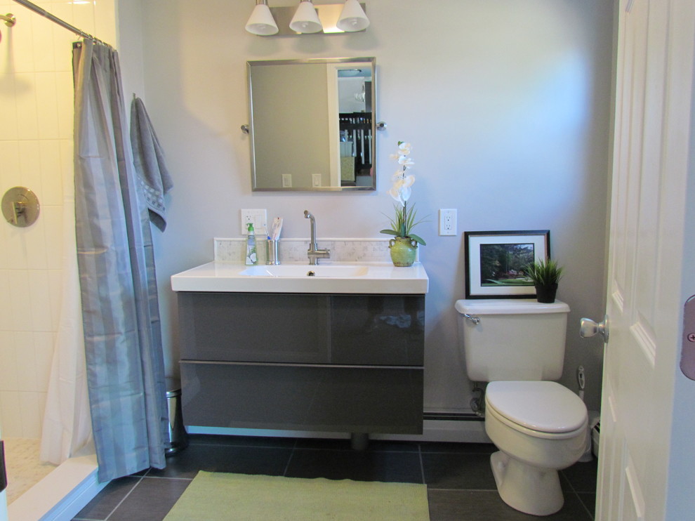 Inspiration for a small midcentury bathroom in Providence with a console sink, grey cabinets, an open shower, a two-piece toilet, porcelain tile, grey walls and porcelain floors.