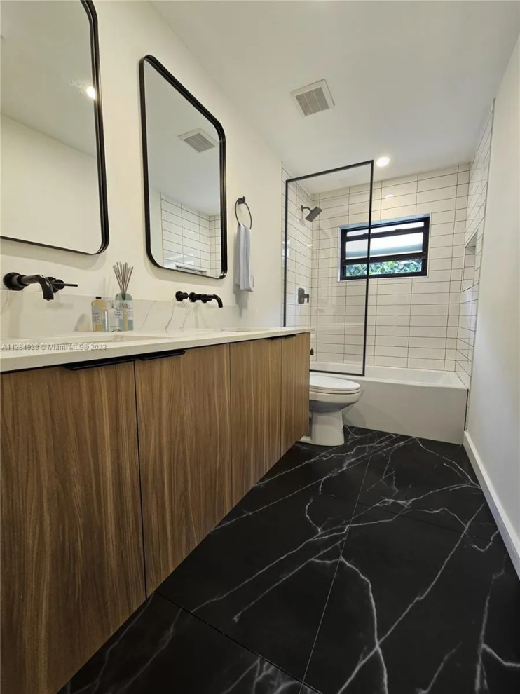 Photo of a medium sized contemporary bathroom in Miami with white walls, porcelain flooring and grey floors.
