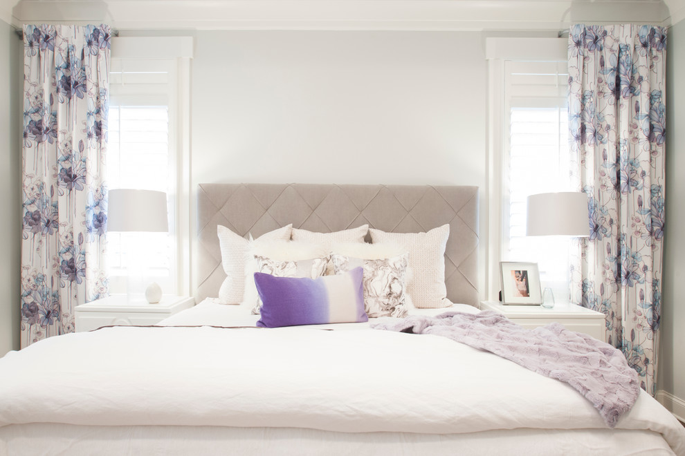 Photo of a transitional bedroom in Charlotte with white walls.