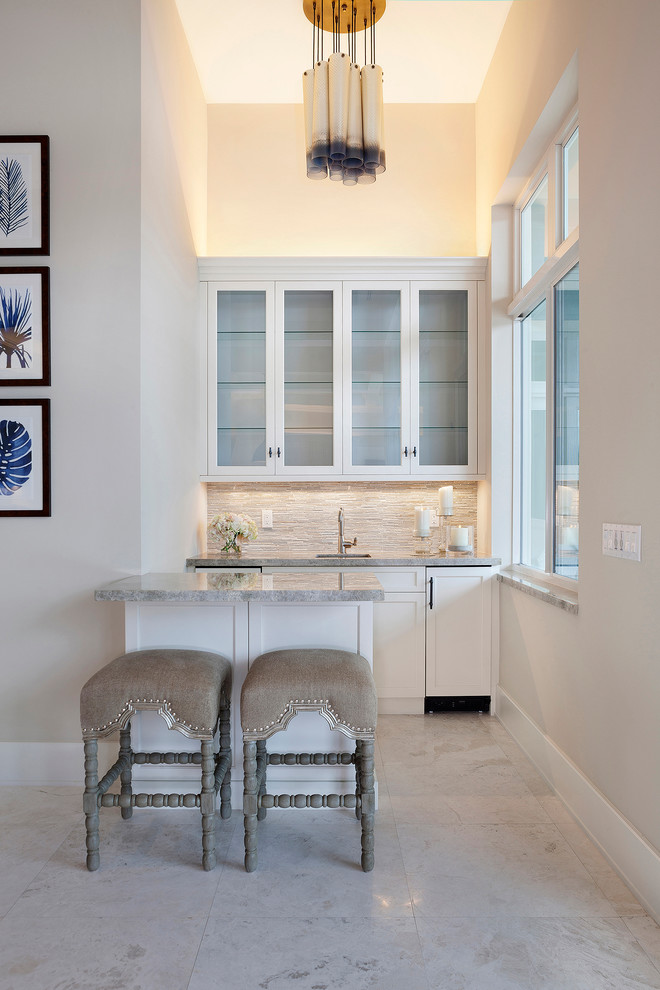 Inspiration for a small transitional galley ceramic tile and beige floor open concept kitchen remodel in Miami with an undermount sink, recessed-panel cabinets, white cabinets, marble countertops, multicolored backsplash, subway tile backsplash, stainless steel appliances, no island and gray countertops