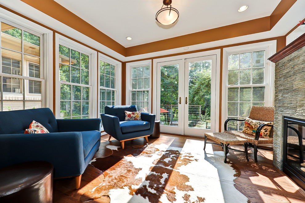 Inspiration for a contemporary sunroom in DC Metro with a stone fireplace surround.