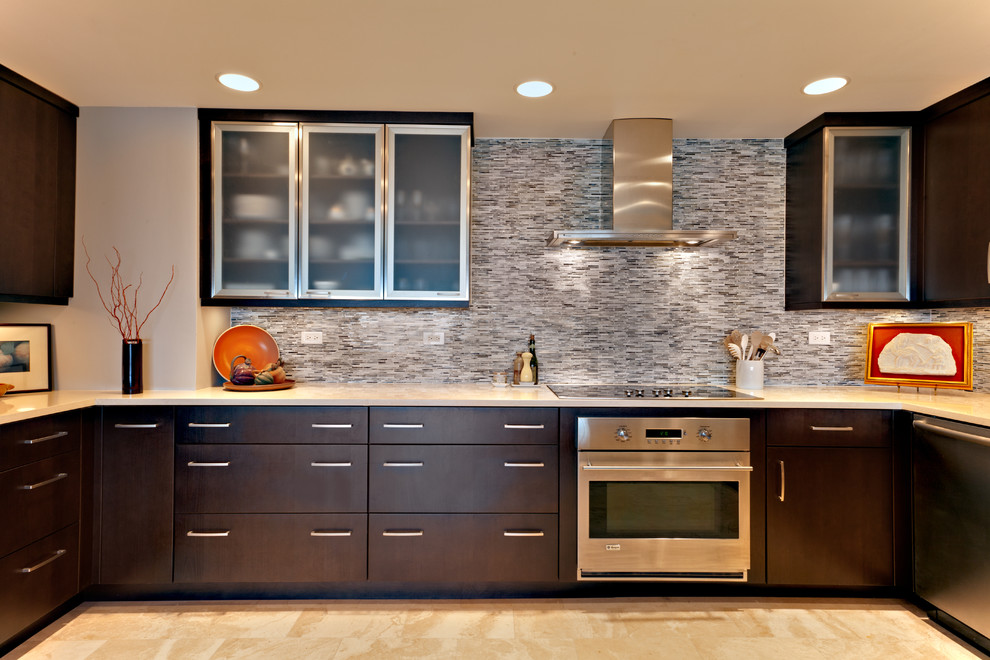 Design ideas for a contemporary u-shaped eat-in kitchen in Nashville with stainless steel appliances, an undermount sink, flat-panel cabinets, dark wood cabinets, multi-coloured splashback, quartz benchtops, mosaic tile splashback, no island, beige floor and white benchtop.