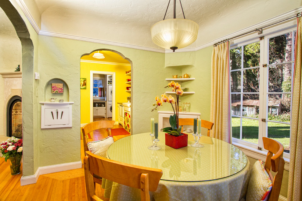 Design ideas for a traditional dining room in Sacramento with green walls and medium hardwood floors.