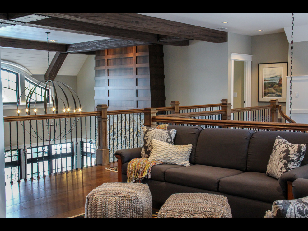 Example of a transitional medium tone wood floor hallway design
