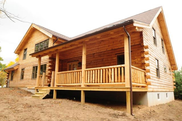 Example of a large mountain style home design design
