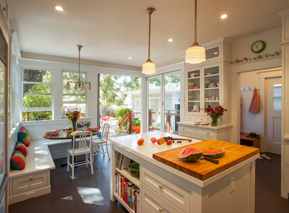 Photo of a country eat-in kitchen in Los Angeles with quartz benchtops, shaker cabinets, white cabinets and with island.