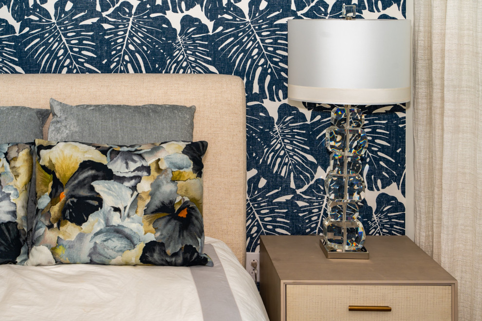 Mid-sized modern guest bedroom in Cedar Rapids with wallpaper.
