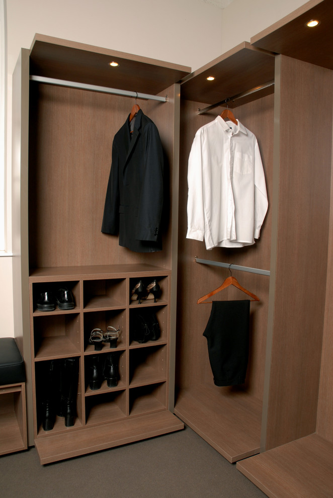 Photo of a large contemporary walk-in wardrobe in Melbourne with light wood cabinets.