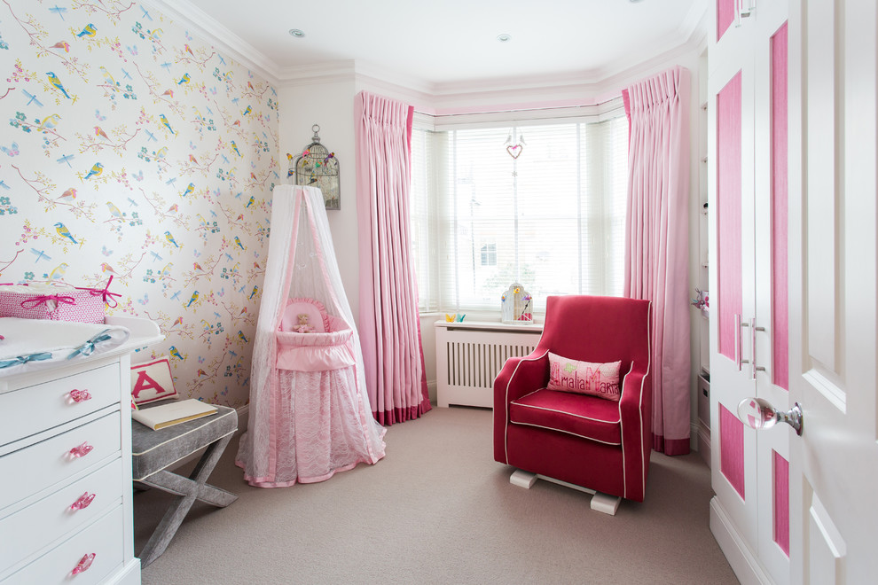 Photo of a transitional nursery in London with multi-coloured walls, carpet and grey floor.