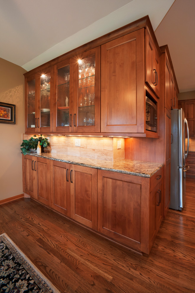 Photo of a kitchen in Wichita with flat-panel cabinets.