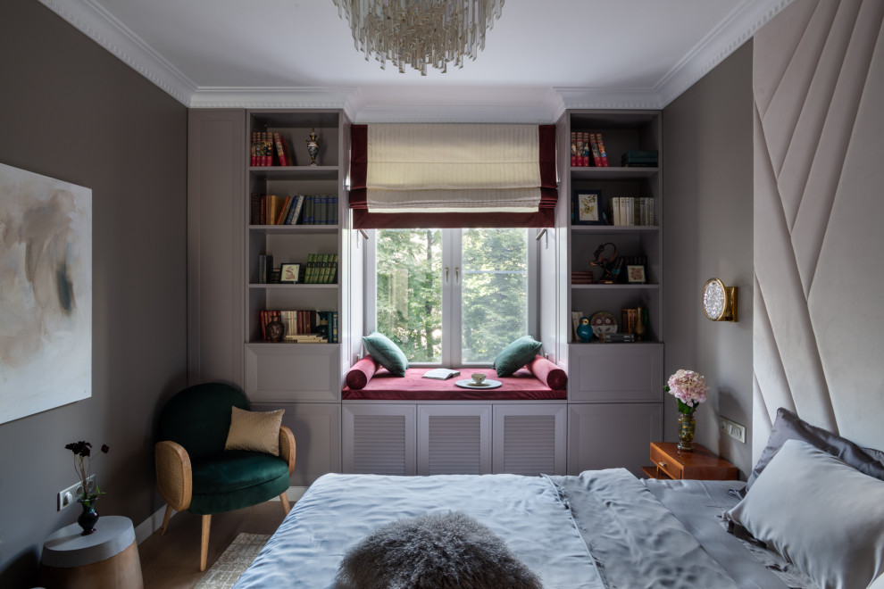 This is an example of a transitional master bedroom in Moscow with grey walls.