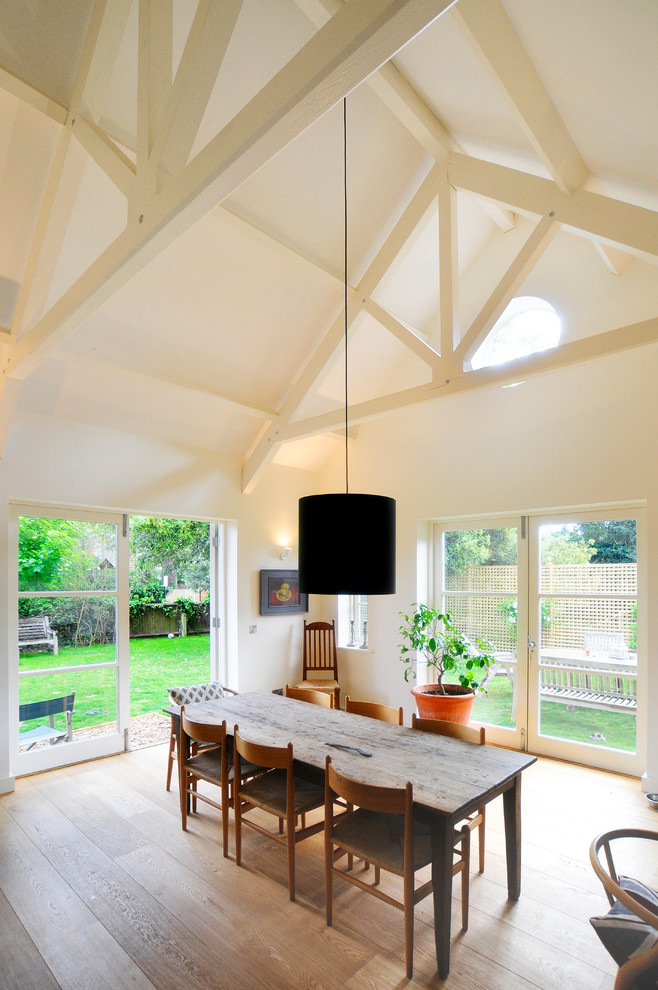 Design ideas for a transitional dining room in Oxfordshire with white walls.