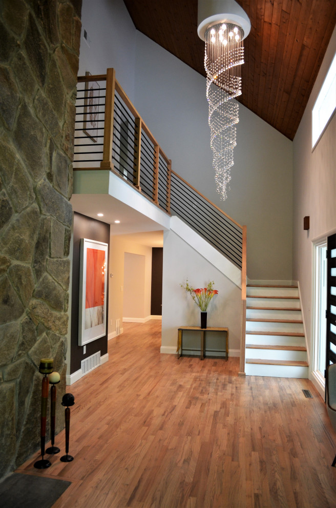 Design ideas for a small contemporary l-shaped staircase in Houston with wood railing.