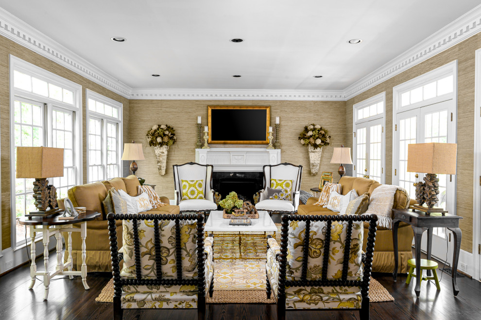 Inspiration for a mid-sized traditional enclosed family room in Charlotte with a wall-mounted tv, brown walls, dark hardwood floors, a standard fireplace, brown floor and wallpaper.