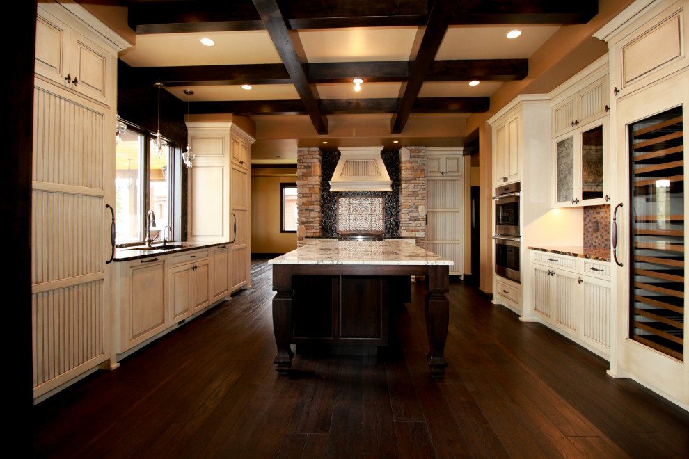 Mountain style u-shaped dark wood floor and coffered ceiling enclosed kitchen photo in Seattle with beaded inset cabinets, white cabinets, mosaic tile backsplash and an island