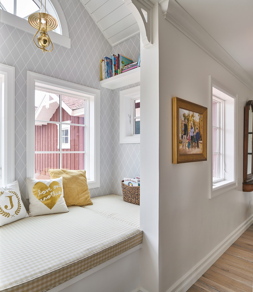 Inspiration for a country light wood floor hallway remodel with gray walls