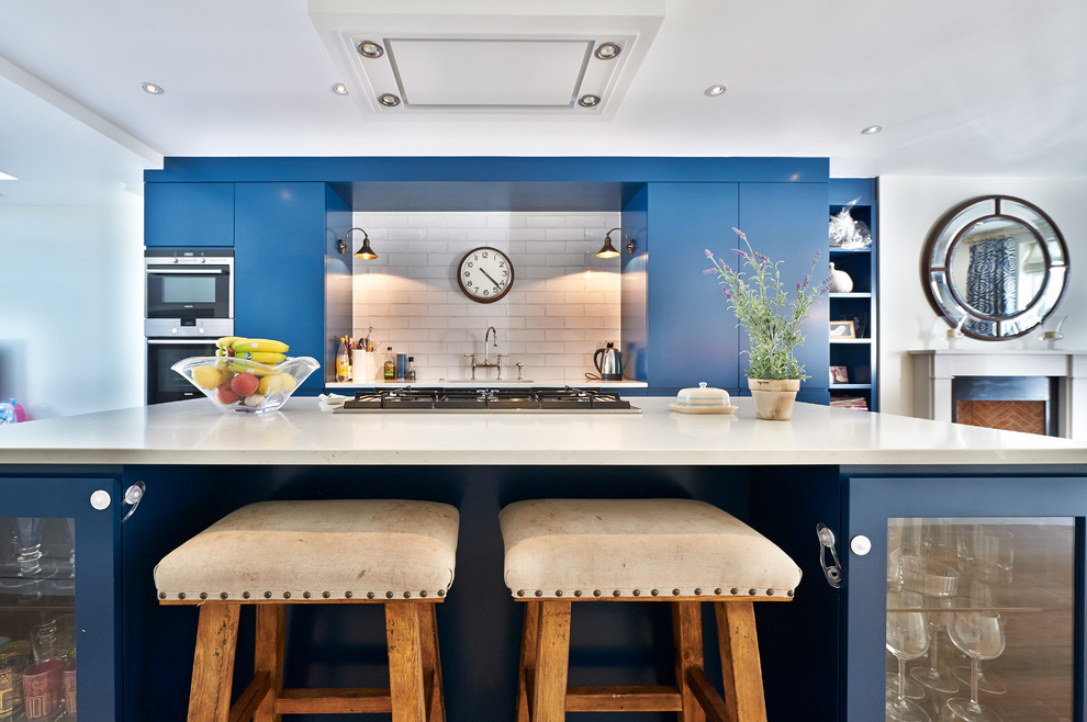 Inspiration for a mid-sized contemporary single-wall kitchen in Surrey with quartz benchtops and with island.