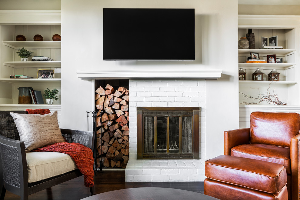Example of a small transitional enclosed dark wood floor family room design in Portland with beige walls, a standard fireplace, a brick fireplace and a wall-mounted tv