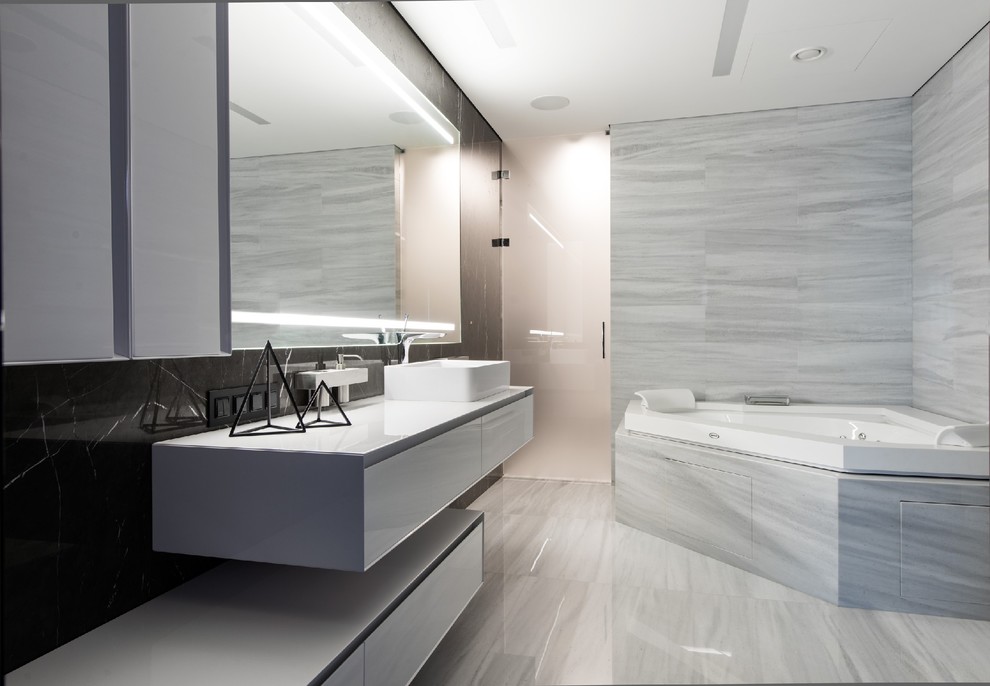 Design ideas for a contemporary master bathroom in Moscow with flat-panel cabinets, white cabinets, a hot tub, gray tile and a vessel sink.