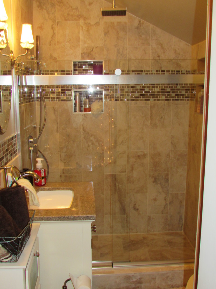 Example of a small transitional master beige tile and ceramic tile ceramic tile home design design with furniture-like cabinets, white cabinets, a two-piece toilet, beige walls, an integrated sink and quartz countertops