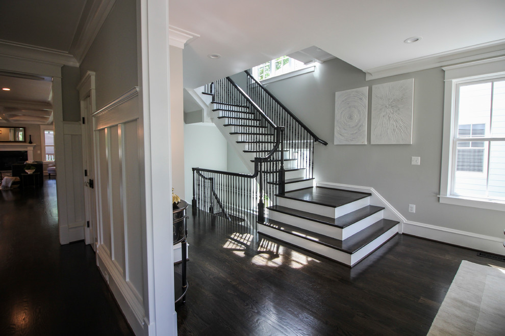 Large transitional wooden l-shaped mixed material railing staircase photo in DC Metro with painted risers